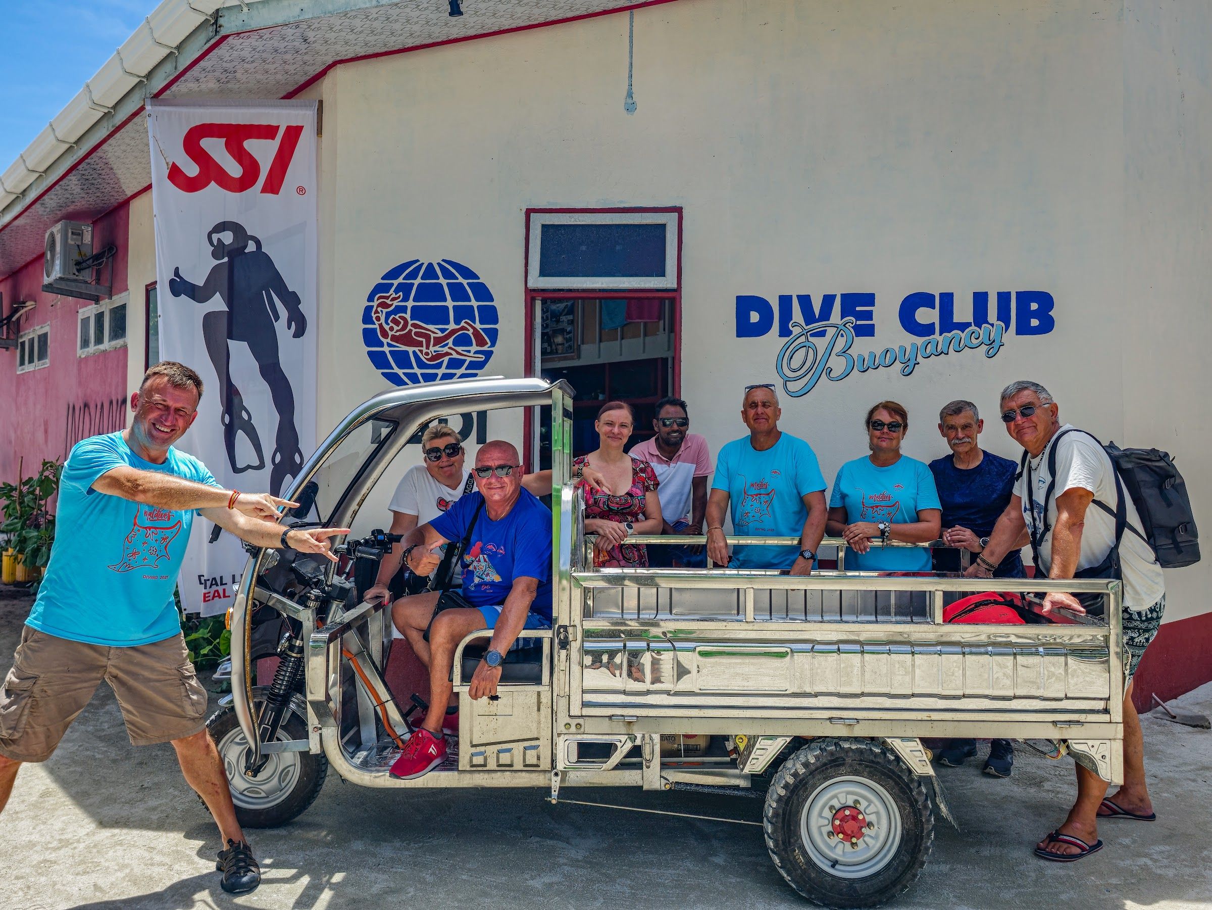 Dive Club Buoyancy team and guests outside the dive shop on Mathiveri
